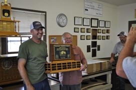 Club President Denny Coulter (R) presenting the Ellise Thompson Trophy (600 yd High Score Shooter) to Russ Thuerer (L)